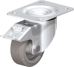 Blickle - 4" Diam x 1-37/64" Wide x 5-7/64" OAH Top Plate Mount Swivel Caster with Brake - Solid Rubber, 440 Lb Capacity, Ball Bearing, 5-1/2 x 4-3/8" Plate - Americas Industrial Supply