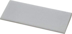 Norton - 4" Long x 1-3/4" Diam x 3/8" Thick, Novaculite Sharpening Stone - Round, Ultra Fine Grade - Americas Industrial Supply