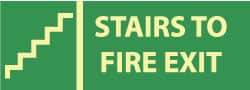 NMC - Stairs to Fire Exit, Pressure Sensitive Vinyl Fire Sign - 14" Wide x 5" High, Glow-in-the-Dark - Americas Industrial Supply