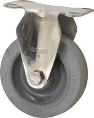Albion - 4" Diam x 1-1/4" Wide x 5-1/8" OAH Top Plate Mount Rigid Caster - Soft Rubber, 410 Lb Capacity, Delrin Bearing, 2-1/2 x 3-5/8" Plate - Americas Industrial Supply