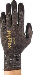 Ansell - Size 2XL (11), ANSI Cut Lvl A2, Abrasion Lvl 4, Nitrile/Polyurethane Coated HPPE Fiber Cut Resistant Gloves - 10.3937" Long, Palm & Fingers Coated, Spandex & Dyneema/Nylon Lining, Knit Wrist, Gray/Black, Paired - Americas Industrial Supply
