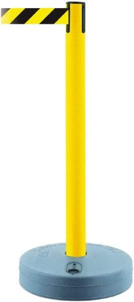 Tensator - 38" High, 2-1/2" Pole Diam, Barricade Tape Dispenser - 14" Base Diam, Round Plastic Base, Yellow Polymer Post, 7-1/2' x 1-7/8" Tape, Single Line Tape, For Outdoor Use - Americas Industrial Supply