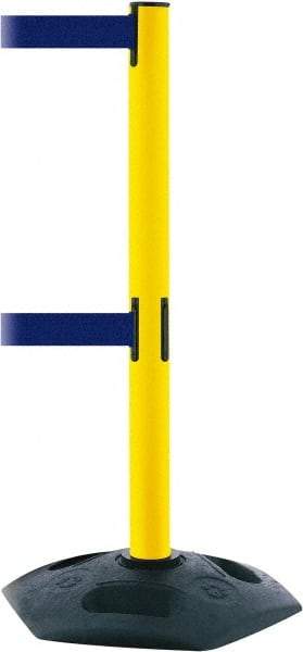 Tensator - 38" High, 2-1/2" Pole Diam, 4 Way Stanchion - 19" Base Diam, Octagon Recycled Rubber Base, Yellow Plastic Post, 7-1/2' x 2" Tape, Dual Line Tape, For Outdoor Use - Americas Industrial Supply