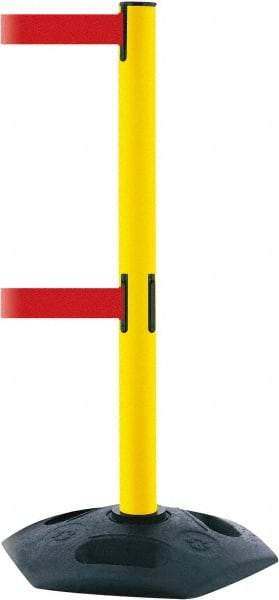 Tensator - 38" High, 2-1/2" Pole Diam, 4 Way Stanchion - 19" Base Diam, Octagon Recycled Rubber Base, Yellow Plastic Post, 7-1/2' x 2" Tape, Dual Line Tape, For Outdoor Use - Americas Industrial Supply