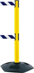 Tensator - 38" High, 2-1/2" Pole Diam, 4 Way Stanchion - 19" Base Diam, Octagon Recycled Rubber Base, Yellow Plastic Post, 13' x 2" Tape, Dual Line Tape, For Outdoor Use - Americas Industrial Supply