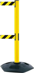 Tensator - 38" High, 2-1/2" Pole Diam, 4 Way Stanchion - 19" Base Diam, Octagon Recycled Rubber Base, Yellow Plastic Post, 13' x 2" Tape, Dual Line Tape, For Outdoor Use - Americas Industrial Supply
