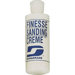 Dynabrade - 4 oz Sanding Creme Compound - Compound Grade Fine, White, For High Glossing, Use on Composites, Fiberglass & Metal - Americas Industrial Supply