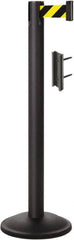 Lavi Industries - 38-1/2" High, 2-3/4" Pole Diam, Stanchion - 12-1/2" Base Diam, Round Steel Base, Black Steel Post, 7' x 2" Tape, Single Line Tape - Americas Industrial Supply