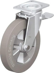 Blickle - 10" Diam x 2" Wide x 11-39/64" OAH Top Plate Mount Swivel Caster with Brake - Solid Rubber, 1,430 Lb Capacity, Ball Bearing, 5-1/2 x 4-3/8" Plate - Americas Industrial Supply