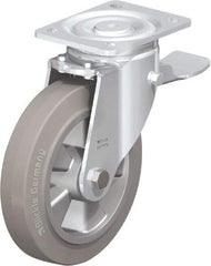 Blickle - 8" Diam x 2" Wide x 9-41/64" OAH Top Plate Mount Swivel Caster with Brake - Solid Rubber, 1,210 Lb Capacity, Ball Bearing, 5-1/2 x 4-3/8" Plate - Americas Industrial Supply
