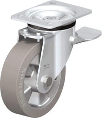 Blickle - 6-1/2" Diam x 1-31/32" Wide x 7-61/64" OAH Top Plate Mount Swivel Caster with Brake - Solid Rubber, 880 Lb Capacity, Ball Bearing, 5-1/2 x 4-3/8" Plate - Americas Industrial Supply