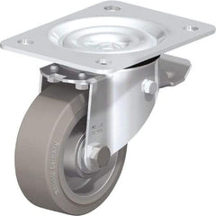 Blickle - 4" Diam x 1-37/64" Wide x 5-7/64" OAH Top Plate Mount Swivel Caster with Brake - Solid Rubber, 440 Lb Capacity, Ball Bearing, 5-1/2 x 4-3/8" Plate - Americas Industrial Supply